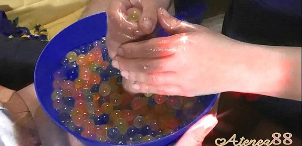  Young girl makes soft hanjob with lots of oil and water balls